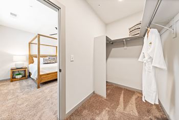 A white towel is hanging on a rack in a room.